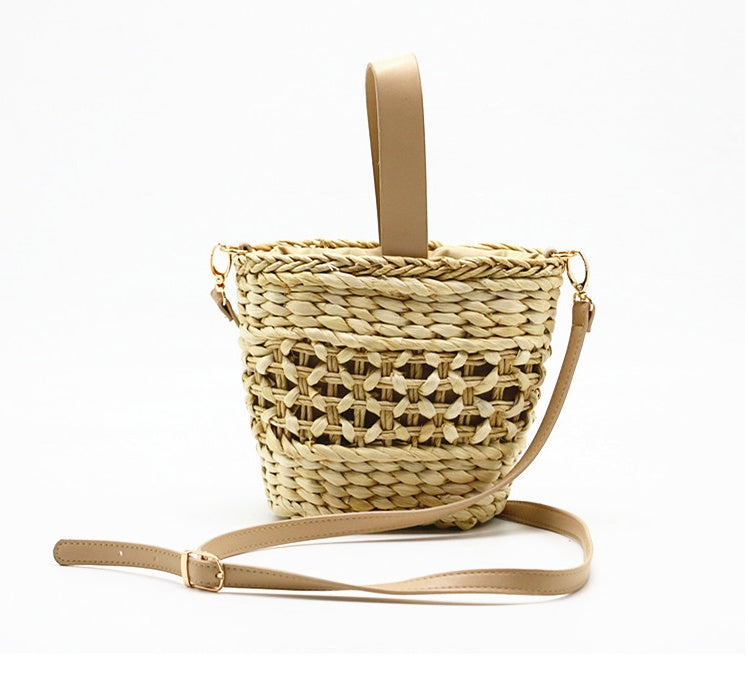 Hand-woven straw handbag