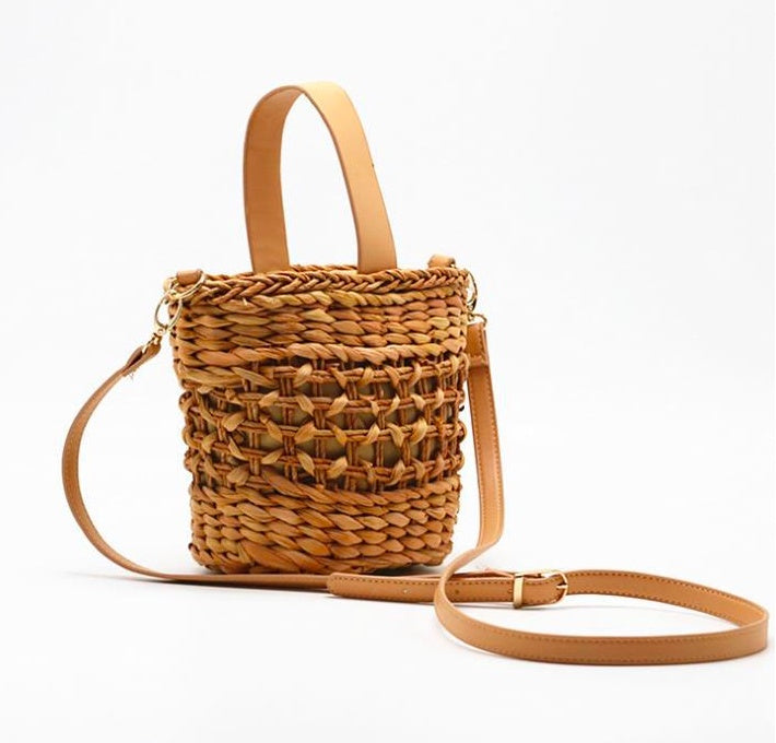 Hand-woven straw handbag