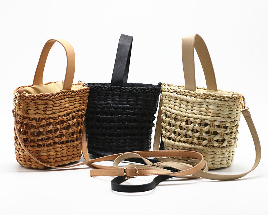 Hand-woven straw handbag