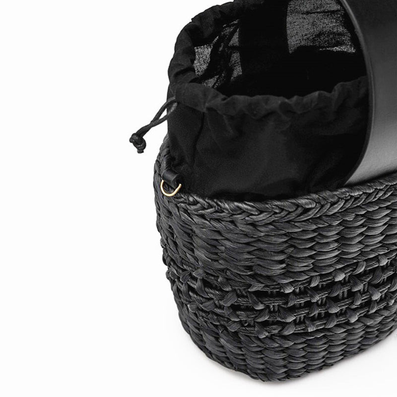 Hand-woven straw handbag