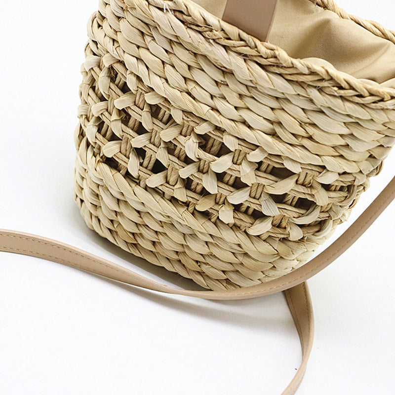 Hand-woven straw handbag